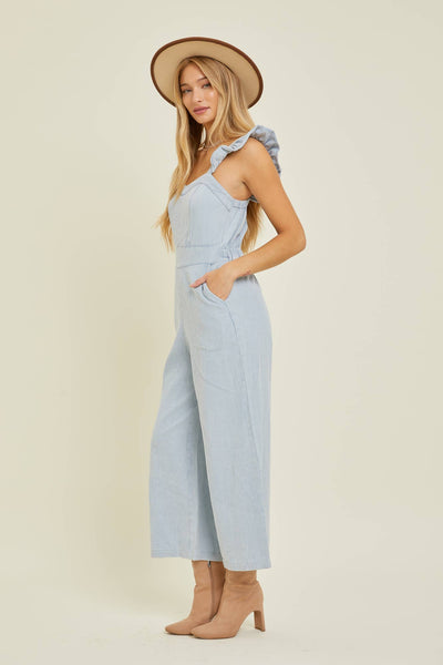 DENIM JUMPSUIT WITH RUFFLE SHOULDER STRAP IN CHAMBRAY-JUMPSUIT-MODE-Couture-Boutique-Womens-Clothing