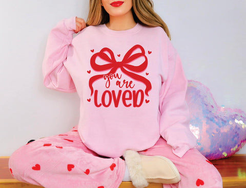 YOU ARE SO LOVED COQUETTE BOW GRAPHIC SWEATSHIRT IN LIGHT PINK-Graphic Sweatshirt-MODE-Couture-Boutique-Womens-Clothing