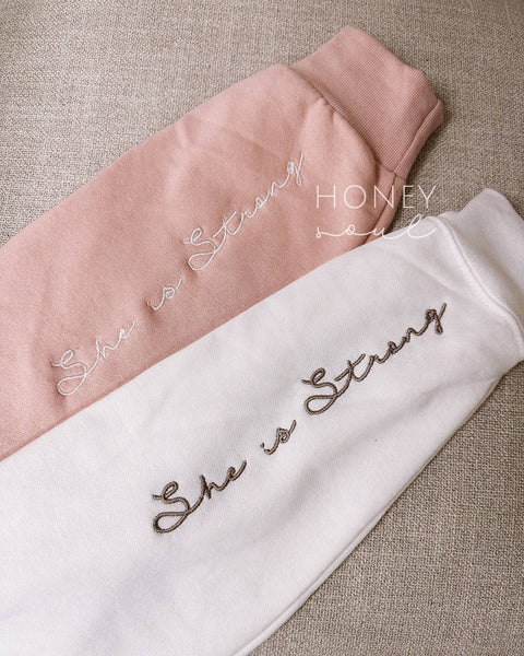 SHE IS STRONG EMBROIDERED CREWNECK SWEATSHIRT IN BLUSH PINK-MODE-Couture-Boutique-Womens-Clothing